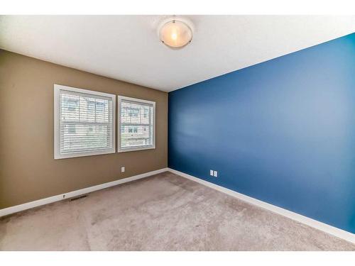 51-28 Heritage Drive, Cochrane, AB - Indoor Photo Showing Other Room