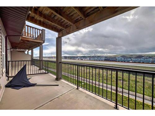 51-28 Heritage Drive, Cochrane, AB - Outdoor With Balcony With Exterior