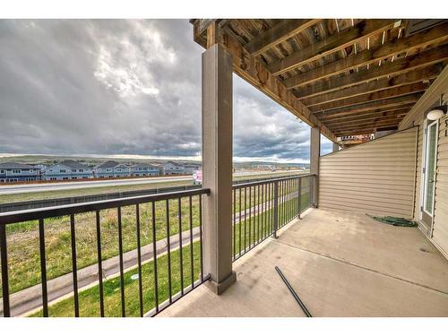 51-28 Heritage Drive, Cochrane, AB - Outdoor With Balcony With Exterior