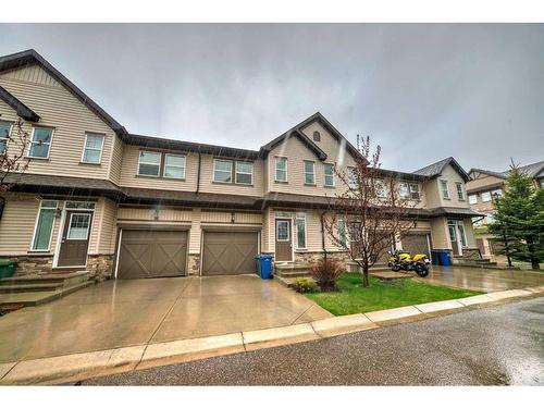 51-28 Heritage Drive, Cochrane, AB - Outdoor With Facade