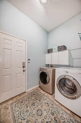 154 New Brighton Manor Se, Calgary, AB - Indoor Photo Showing Laundry Room