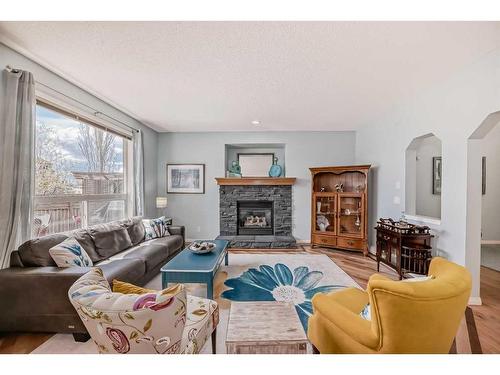 154 New Brighton Manor Se, Calgary, AB - Indoor Photo Showing Living Room With Fireplace