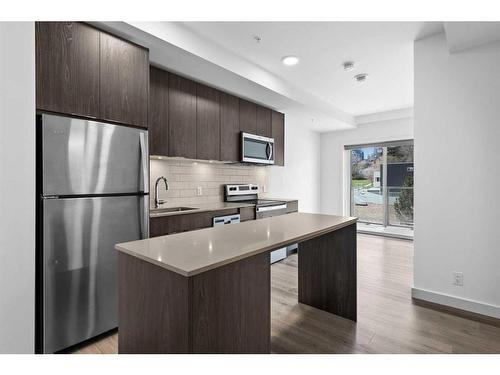 306-455 1St Avenue Ne, Calgary, AB - Indoor Photo Showing Kitchen With Stainless Steel Kitchen With Upgraded Kitchen