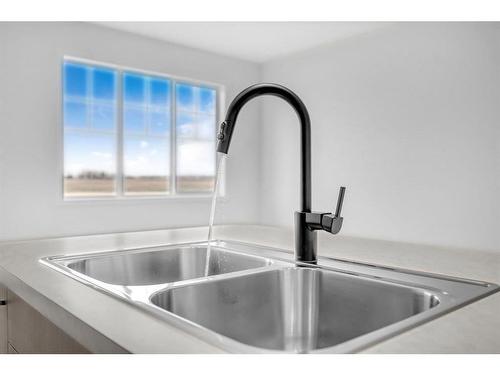 120 Cityline Square Ne, Calgary, AB - Indoor Photo Showing Kitchen With Double Sink