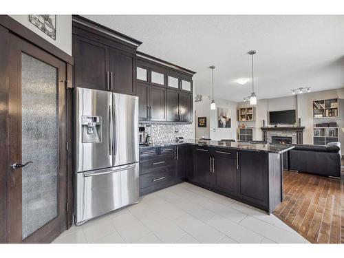 569 Luxstone Landing Sw, Airdrie, AB - Indoor Photo Showing Kitchen With Upgraded Kitchen