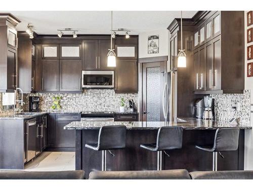 569 Luxstone Landing Sw, Airdrie, AB - Indoor Photo Showing Kitchen With Upgraded Kitchen