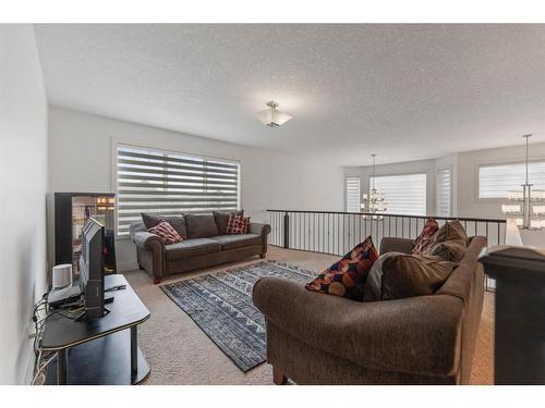 388 Kinniburgh Boulevard, Chestermere, AB - Indoor Photo Showing Living Room