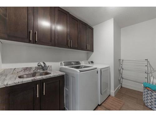 388 Kinniburgh Boulevard, Chestermere, AB - Indoor Photo Showing Laundry Room
