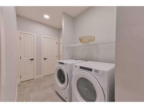 376 Precedence Hill, Cochrane, AB - Indoor Photo Showing Laundry Room