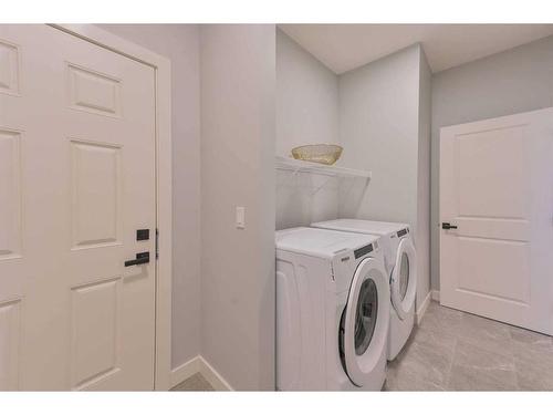 376 Precedence Hill, Cochrane, AB - Indoor Photo Showing Laundry Room