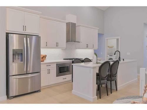 376 Precedence Hill, Cochrane, AB - Indoor Photo Showing Kitchen With Stainless Steel Kitchen