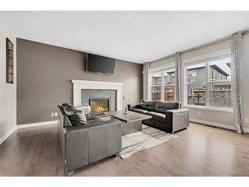 54 Auburn Meadows Court Se, Calgary, AB - Indoor Photo Showing Living Room With Fireplace