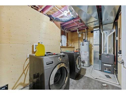 43 Hawkridge Boulevard, Penhold, AB - Indoor Photo Showing Laundry Room