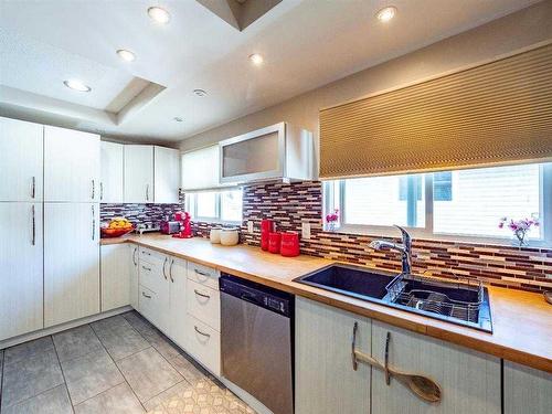 139 Manora Crescent Ne, Calgary, AB - Indoor Photo Showing Kitchen With Double Sink