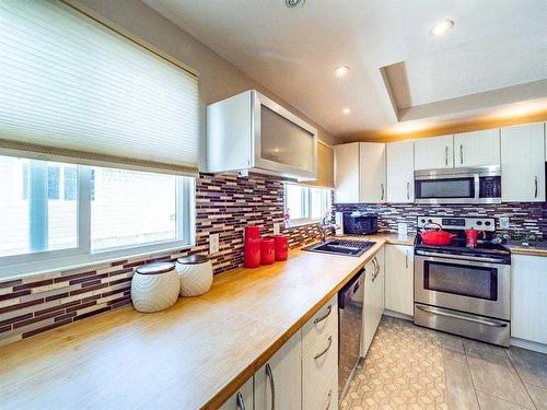 139 Manora Crescent Ne, Calgary, AB - Indoor Photo Showing Kitchen With Double Sink