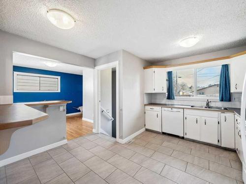 83 Lake Sylvan Close Se, Calgary, AB - Indoor Photo Showing Kitchen With Double Sink