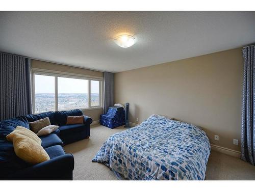 36 Coulee Park Sw, Calgary, AB - Indoor Photo Showing Bedroom