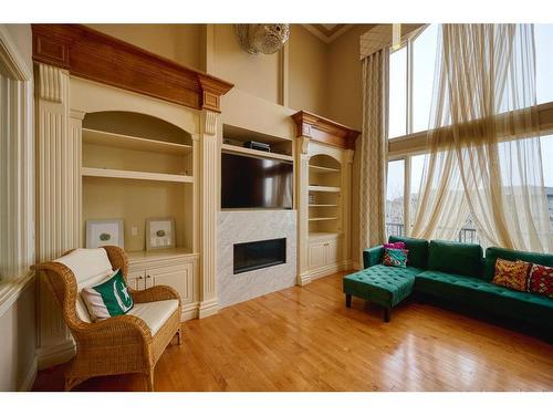36 Coulee Park Sw, Calgary, AB - Indoor With Fireplace