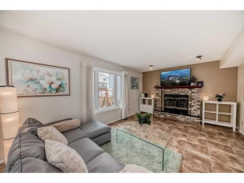 159 Macewan Valley Mews Nw, Calgary, AB - Indoor Photo Showing Living Room With Fireplace