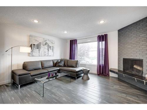 651 Willesden Drive Se, Calgary, AB - Indoor Photo Showing Living Room With Fireplace