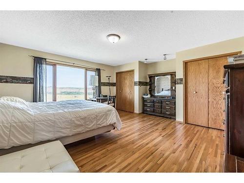 200-274128 320 Street East, Rural Foothills County, AB - Indoor Photo Showing Bedroom
