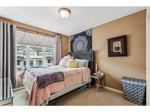 295 Sunset Point, Cochrane, AB - Indoor Photo Showing Bedroom