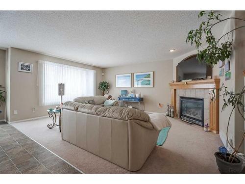 638 Citadel Drive Nw, Calgary, AB - Indoor Photo Showing Living Room With Fireplace