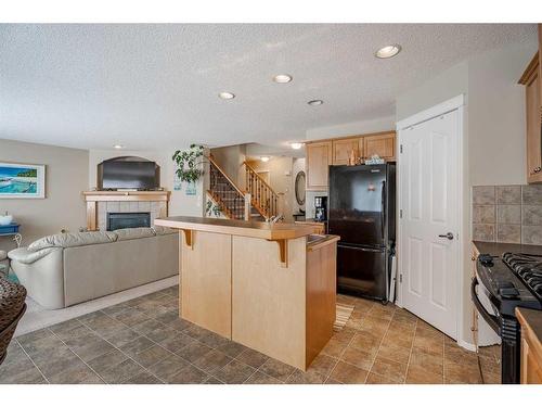 638 Citadel Drive Nw, Calgary, AB - Indoor Photo Showing Kitchen With Fireplace