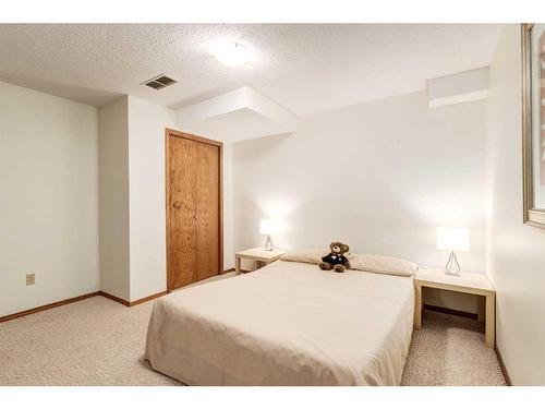 130 Hawkstone Drive Nw, Calgary, AB - Indoor Photo Showing Bedroom