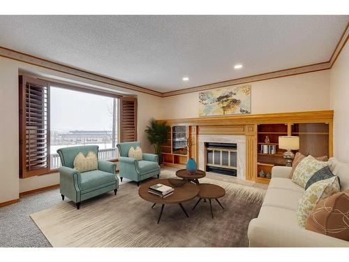 12 Scenic Glen Crescent Nw, Calgary, AB - Indoor Photo Showing Living Room With Fireplace