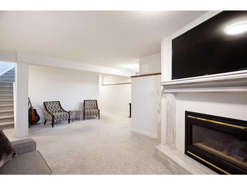 196 Mt Douglas Point Se, Calgary, AB - Indoor Photo Showing Living Room With Fireplace