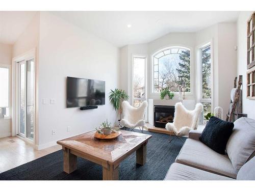 196 Mt Douglas Point Se, Calgary, AB - Indoor Photo Showing Living Room With Fireplace