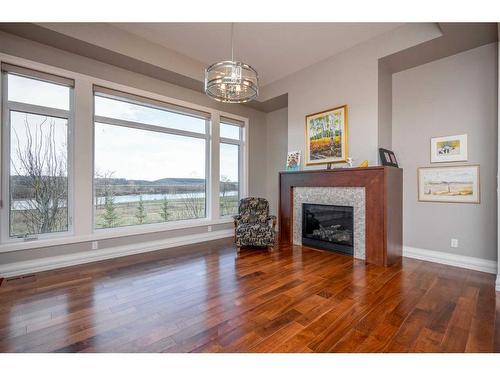 22 Cranbrook Landing Se, Calgary, AB - Indoor Photo Showing Living Room With Fireplace