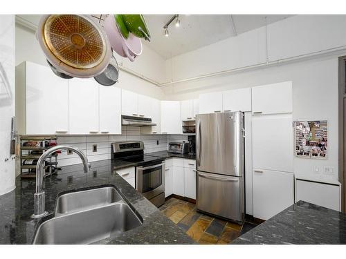 102-240 11 Avenue Sw, Calgary, AB - Indoor Photo Showing Kitchen With Stainless Steel Kitchen With Double Sink