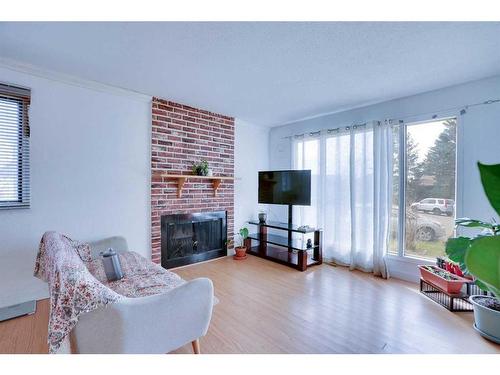 52 Falbury Bay Ne, Calgary, AB - Indoor Photo Showing Living Room With Fireplace