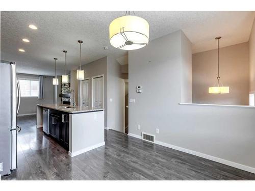652 Copperpond Boulevard Se, Calgary, AB - Indoor Photo Showing Kitchen With Upgraded Kitchen