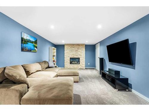 715 84 Avenue Sw, Calgary, AB - Indoor Photo Showing Living Room With Fireplace
