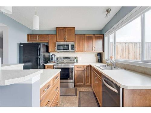151 Elgin Meadows Gardens Se, Calgary, AB - Indoor Photo Showing Kitchen With Stainless Steel Kitchen With Double Sink