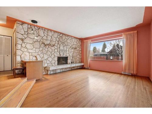 64 Chinook Drive Sw, Calgary, AB - Indoor Photo Showing Living Room With Fireplace