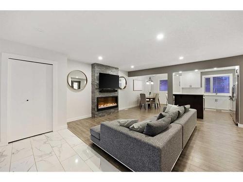 316 Ashley Crescent Se, Calgary, AB - Indoor Photo Showing Living Room With Fireplace