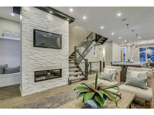 645 36 Street Sw, Calgary, AB - Indoor Photo Showing Living Room With Fireplace