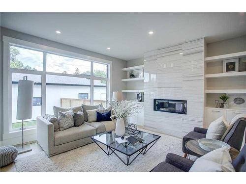 645 36 Street Sw, Calgary, AB - Indoor Photo Showing Living Room With Fireplace