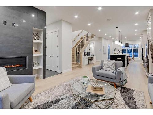 645 36 Street Sw, Calgary, AB - Indoor Photo Showing Living Room With Fireplace