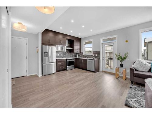 201-135 Redstone Walk Ne, Calgary, AB - Indoor Photo Showing Kitchen With Stainless Steel Kitchen