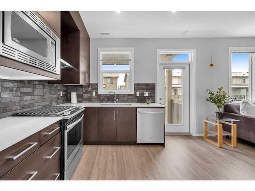 201-135 Redstone Walk Ne, Calgary, AB - Indoor Photo Showing Kitchen With Upgraded Kitchen