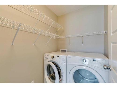 217 Sunset Point, Cochrane, AB - Indoor Photo Showing Laundry Room