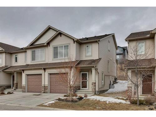 217 Sunset Point, Cochrane, AB - Outdoor With Facade