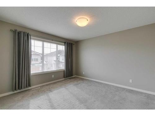 217 Sunset Point, Cochrane, AB - Indoor Photo Showing Other Room