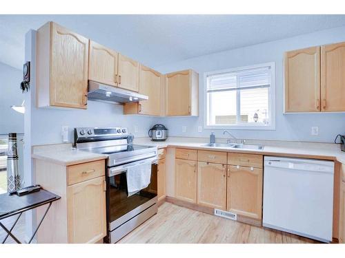 83 Martin Crossing Grove Ne, Calgary, AB - Indoor Photo Showing Kitchen With Double Sink