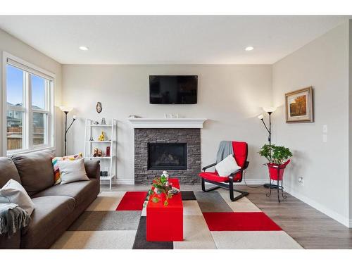 32 Cranbrook Circle Se, Calgary, AB - Indoor Photo Showing Living Room With Fireplace